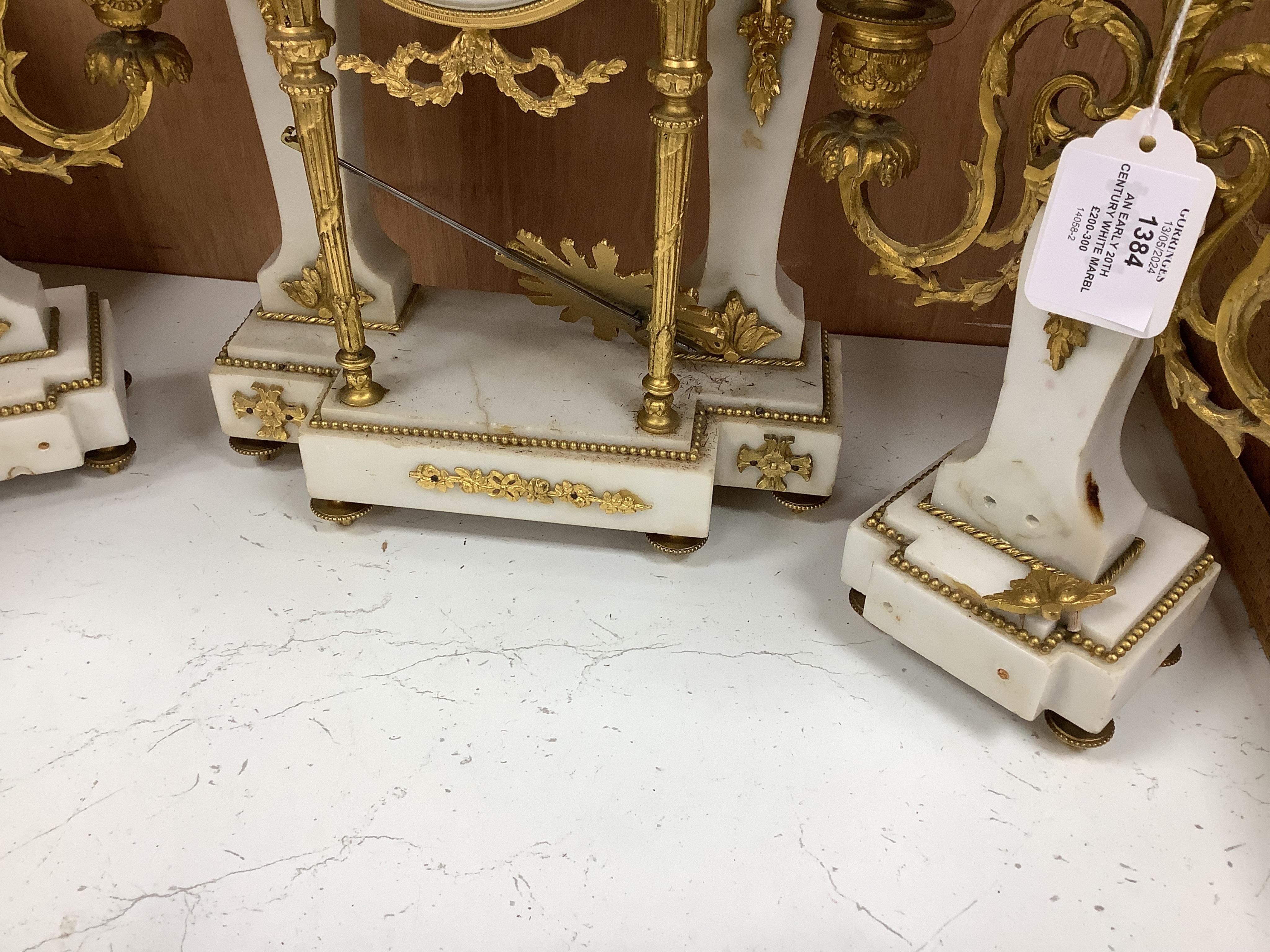 An early 20th century white marble and ormolu clock garniture with Arabic enamelled dial, 42cm high